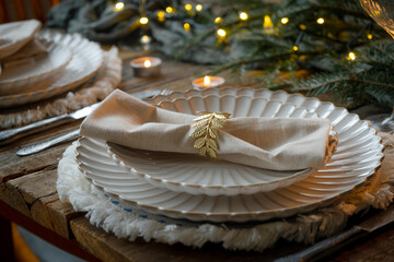 Elegant Christmas table setting. Festive table decorated for Christmas dinner.