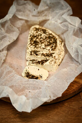 Craft cheese cut into pieces on a cutting board