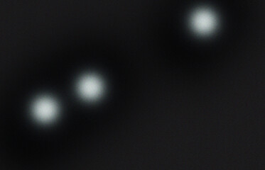 Abstract dark background with three blurred lights creating a mysterious and atmospheric mood perfect for adding depth and intrigue to creative projects and designs