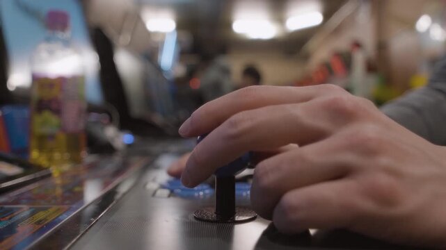 Close up of a male hand using a arcade fight stick, Japan