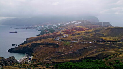Cloudy panorama seaside town washed deep ocean. Drone view road stretching 