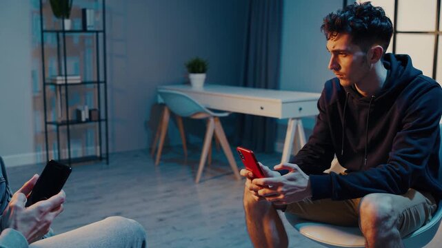 Psychologist and patient distracted by smartphones during therapy session