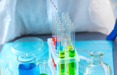 Test tubes and reagents to the lab. Selective focus.