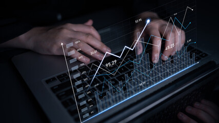 Person using laptop to analyze financial data with graphic overlay showing market trends and statistics. Ideal for business and finance themes in digital media. Scalp