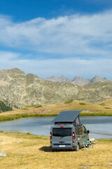 Obraz premium Camper van parked near a lake in Piedmont, Italy