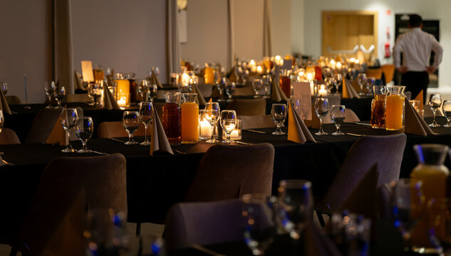 Table in a hotel restaurant filled with drinks during a corporate event