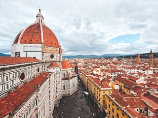 Aerial view of Florence, Italy. Dome of the Duomo (Florence Cathedral) and a cityscape of terracotta rooftops