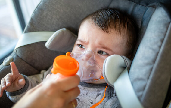 Baby cries during nebulizer treatment for an upper respiratory tract infection