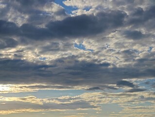 cumulus and stratus clouds in sky at dusk