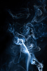 Blue hot curly steam smoke isolated on black background. Abstract background, design element, for...