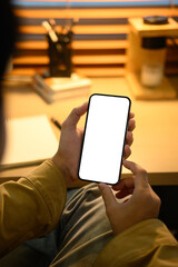 Man hands holding smart phone with blank screen for your text message or information