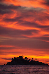 Montenegro, Europe: a fiery sunset on Buljarica beach, one of the largest beaches of the coast, close to Petrovac in direction of Bar (Budva municipality)

