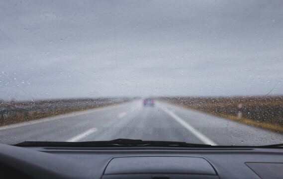 Car rain driving in bad weather highway windshield  rain drops