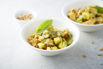 Chicken with celery, zucchini and pine nuts
