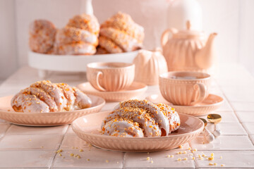 Sweet saint martin's croissant decorated with almonds and orange peel.