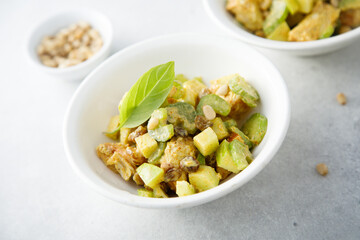 Chicken with celery, zucchini and pine nuts