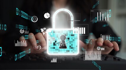 Hands typing on a keyboard with overlay of a glowing lock symbol and data visualizations, representing digital security, privacy, and cyber protection in a modern office setting. Xenic