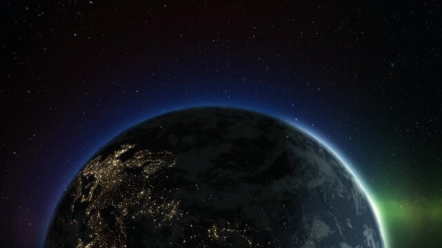 View from space of the slowly rotating planet earth during sunrise as view from space with vibrant blue sky atmosphere. The lights of night cities are visible from Earth orbit. 4k footage