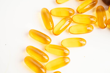 Fish oil or Cod liver oil gel in capsules with omega 3 vitamins, supplementary healthy food.
