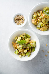 Chicken with celery, zucchini and pine nuts