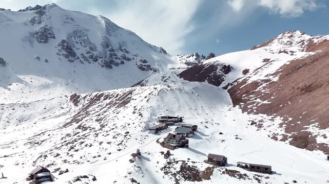 Aerial of snowy mountain range with snow
