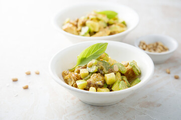Chicken with celery, zucchini and pine nuts