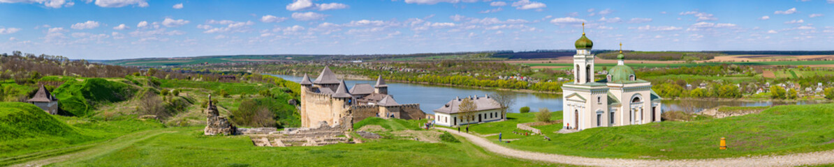 A stunning panoramic landscape of the historic Khotyn Fortress and Alexander Nevsky Church on the...