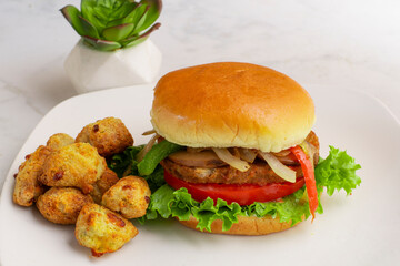 veggie burger served with veggie tots