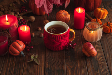 Cozy Autumn Scene with Mulled Wine, Candles, Pumpkins and Seasonal Decor