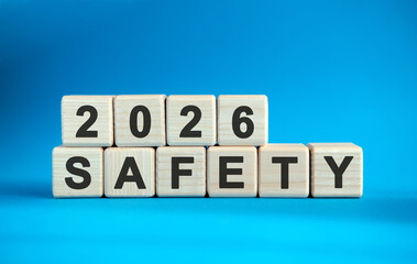 New year Safety 2026 concept. Wooden cubes on a blue background