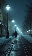 Fototapeta premium A person walks alone along a snowy night street. Figure in dark coat moves toward glowing street lights. Cold winter atmosphere with snow and fog at urban area