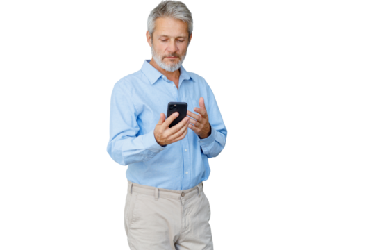 Senior man focused, holding a smartphone, communicating and browsing content. Transparent background - Powered by Adobe