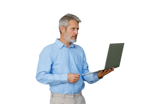 Gray-haired professional man holding open laptop, focused and thoughtful while working remotely against transparent background