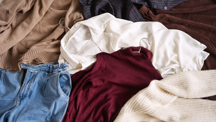 The top view of the autumn women's capsule wardrobe lies on the floor.