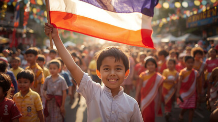 Proud Thai boy holding flag on Children&rsquo;s Day
