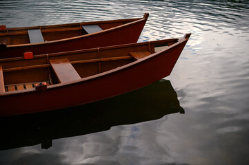 Wooden Rowboats on Calm Water