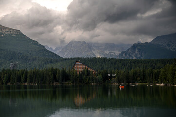 Serene Mountain Lake with Triangular Building