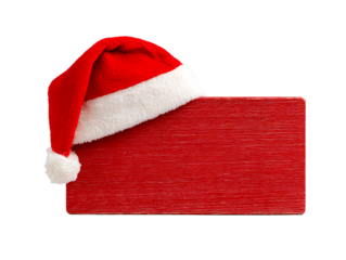 Santa hat rests on a textured red sign board