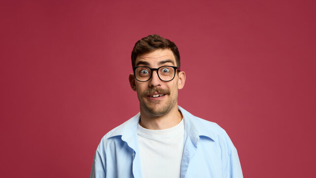 Astonished man with wide eyes and funny surprised face expression. Concept of digital communication, meme design, reaction post, and expressive social media marketing.