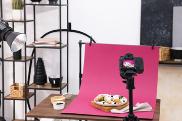 Shooting tasty croissants with camera in studio. Professional food photography