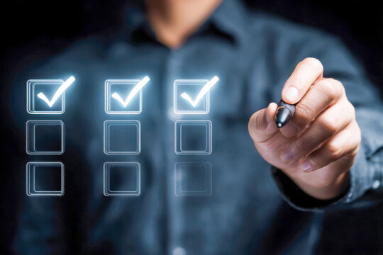 Businessman marking glowing checklist boxes with digital pen symbolizing task completion and efficient project management in a futuristic interface environment