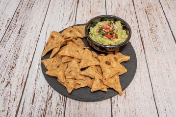  nachos with shredded pork, pickled red onion, and homemade taco salsa verde
