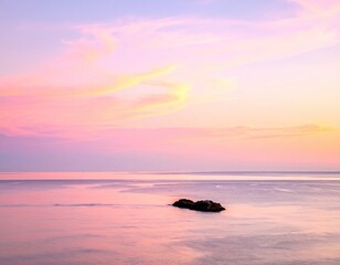 Pink And Orange Sunset Over Calm Ocean With Dark Rocks