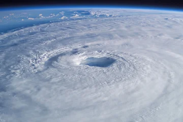 Fototapete Wohnzimmer Hurricane Melissa 2025. Powerful hurricane seen from space with a clearly defined eye, swirling clouds. Super Typhoon, tropical storm, cyclone, hurricane, tornado, over ocean. Weather background  © alones