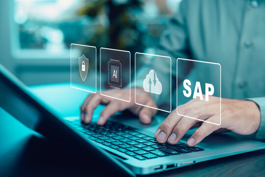 businessman working on computer with icons of SAP - Business process automation software. ERP enterprise resources planning system concept.Program helps manage business to access information.