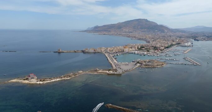 Aerial view of Trapani, Sicily, Italy. It is a Sicilian city with a port overlooking the Mediterranean Sea. Mount Erice dominates the town in the background.