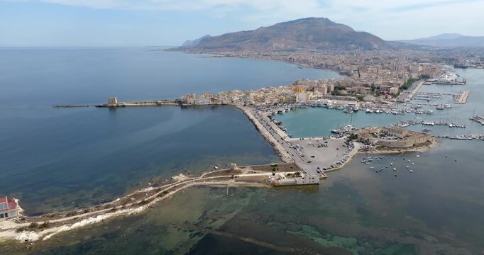 Aerial view of Trapani, Sicily, Italy. It is a Sicilian city with a port overlooking the Mediterranean Sea. Mount Erice dominates the town in the background.