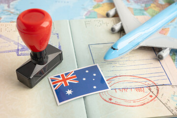 Australia flag with passport and airplane for travel.