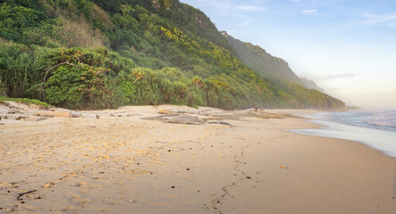Beach with a mountain in the background