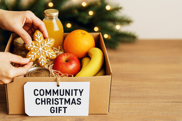 Christmas gift box with fruits and gingerbread cookie for charity donation